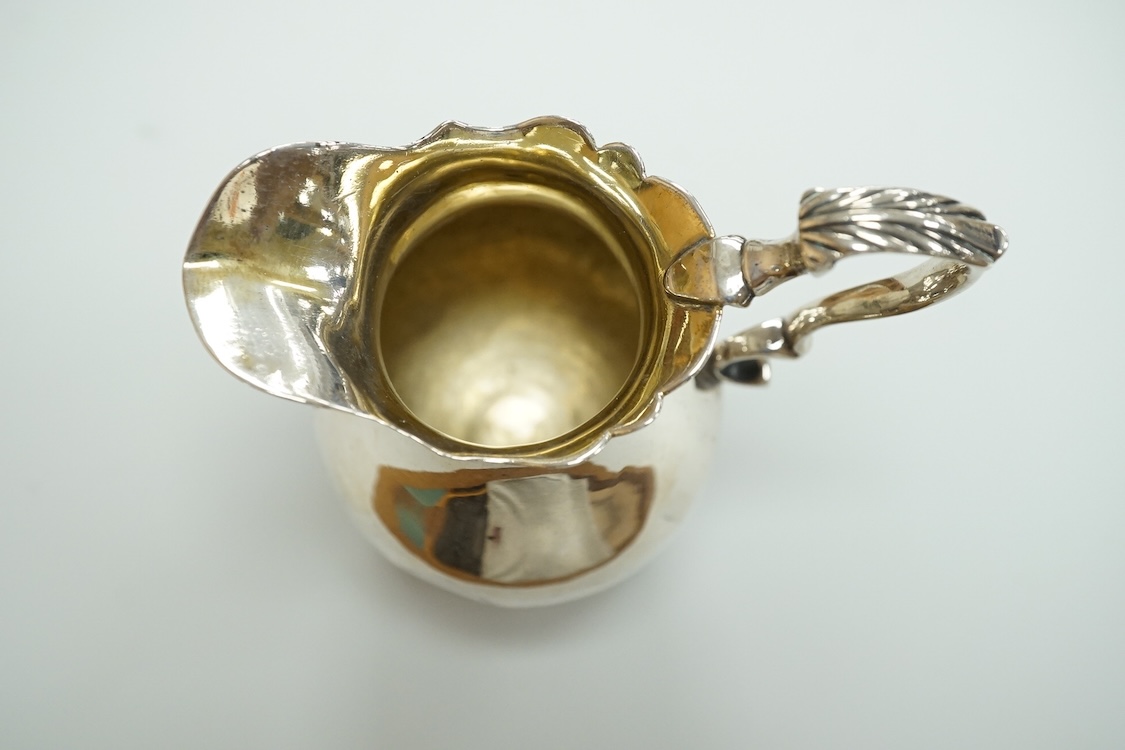 A George II silver baluster cream jug, George Greenhill Jones, London, 1743, height 96mm.